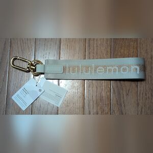 NWT Lululemon "Never Lost" Keychain in vapor/gold